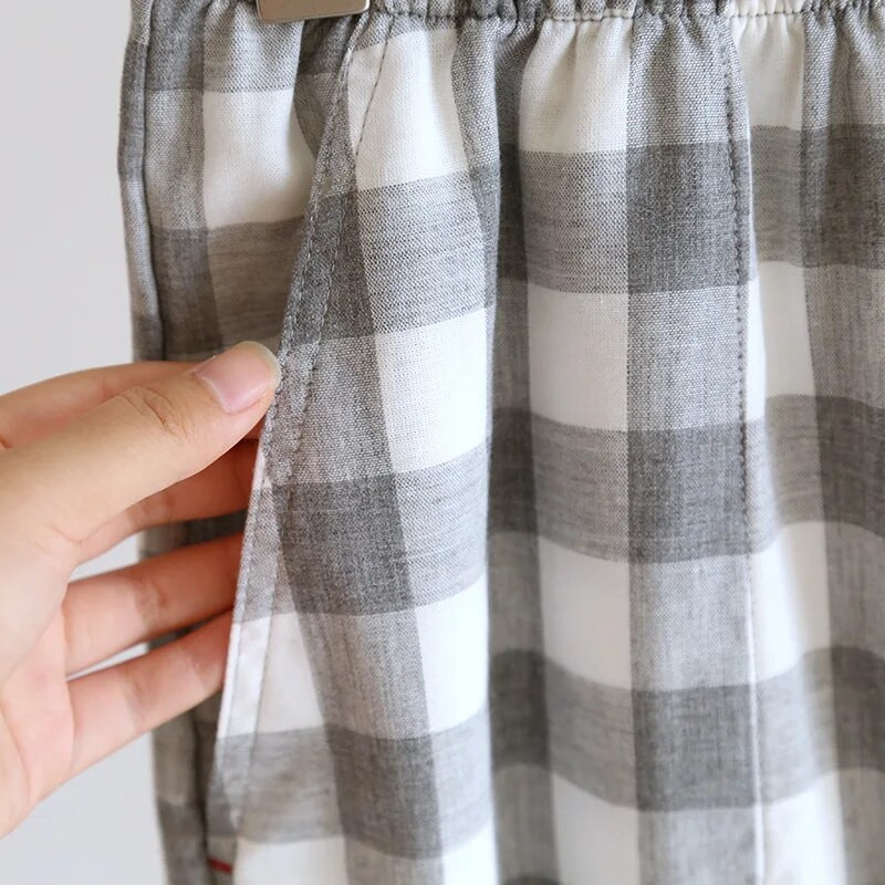Jaciņas vienkrāsaini topi ar garām piedurknēm ar garu bikšu rūtu apdrukātu kokvilnas pidžamu komplekti Vīriešu mājas apģērbi pavasarim un rudenim