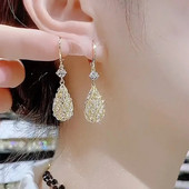 Luksusa rotaslietas sievietēm Cirkona caurdurti ūdens pilienu auskari sievietēm Bohēmijas temperamenta Eleganti Rhinestone Auskari pendientes