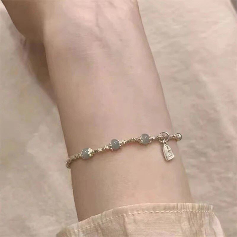 2023. gada Dienvidkorejas jaunā Hetiānas nefrīta sudraba rokassprādzes imitācija sievietēm ar daudzpusīgu kaķa acu rotaslietas dāvanu