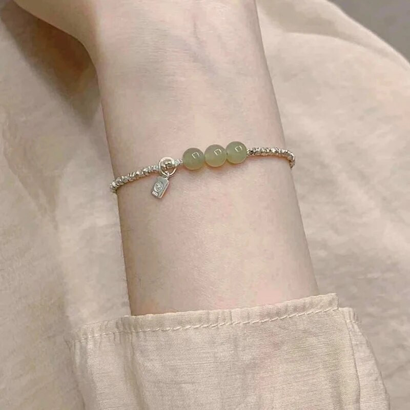 2023. gada Dienvidkorejas jaunā Hetiānas nefrīta sudraba rokassprādzes imitācija sievietēm ar daudzpusīgu kaķa acu rotaslietas dāvanu