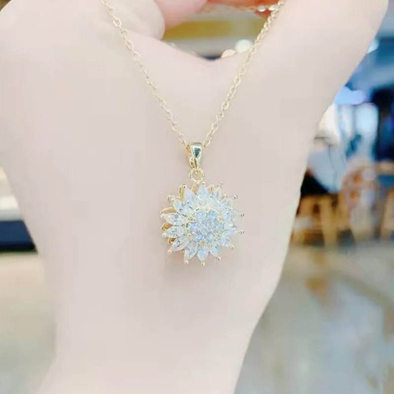 Luksusa modes cirkona rotācijas margrietiņa saulespuķu kulons kaklarota, rotējoša kristāla ziedu nerūsējošā tērauda dizaineru rotaslietas