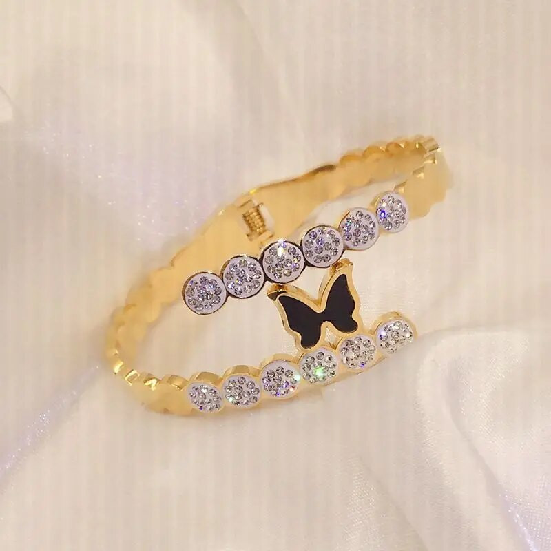 Titāna tērauda jauna modes melna tauriņa rokassprādze ar pavasara atvēršanas dizaina sieviešu nerūsējošā tērauda rokassprādzēm