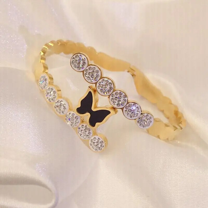 Titāna tērauda jauna modes melna tauriņa rokassprādze ar pavasara atvēršanas dizaina sieviešu nerūsējošā tērauda rokassprādzēm