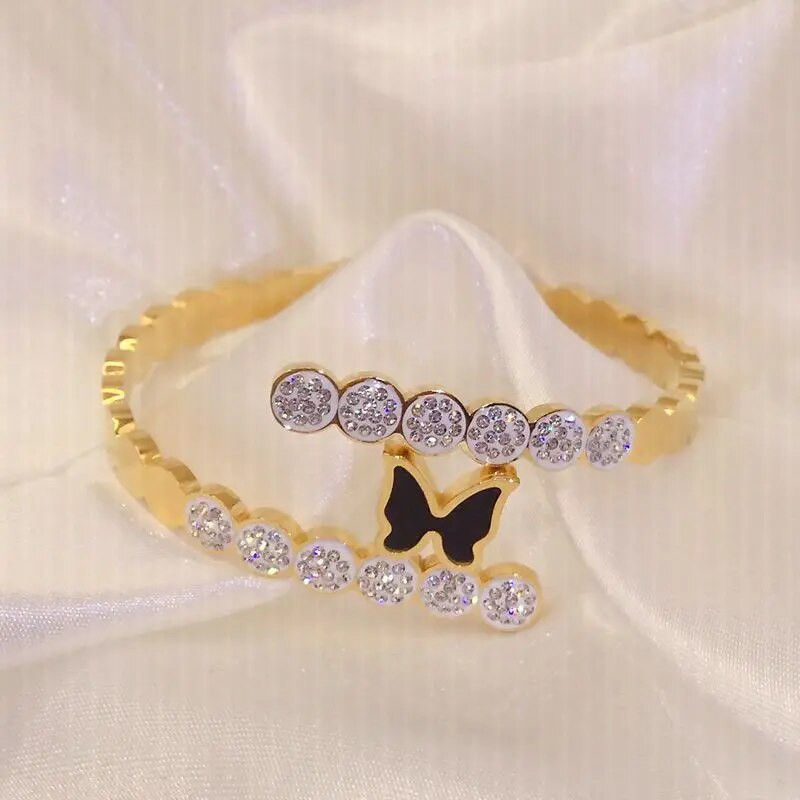 Titāna tērauda jauna modes melna tauriņa rokassprādze ar pavasara atvēršanas dizaina sieviešu nerūsējošā tērauda rokassprādzēm