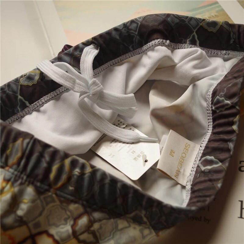 2021 m. vasaros vyriški maudymosi kostiumėliai šortai Firminiai paplūdimio drabužiai Seksualūs maudymosi lagaminai Vyriški maudymosi kostiumėliai žemu juosmeniu, kvėpuojantis paplūdimio drabužis