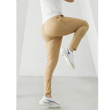 Панталони за бягане Мъжко спортно облекло Еластични спортни панталони за джогинг Тесни панталони за фитнес Фитнес Бързосъхнещи тънки анцузи Тренировъчни спортни панталони