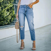 Sieviešu džinsi, zili, elastīgi, ar augstu vidukli. Ikdienišķa modes modes plēstas ielas apģērba džinsa zīmuļbikses 2023. gada tendence