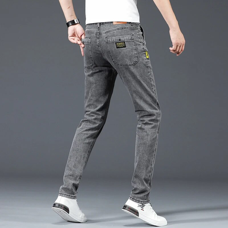 Vīriešu pelēki džinsi Ikdienišķas, elastīgas, plānas, mazas pēdas, garas džinsa bikses Modes, daudzpusīga dizaina ikdienas bikses