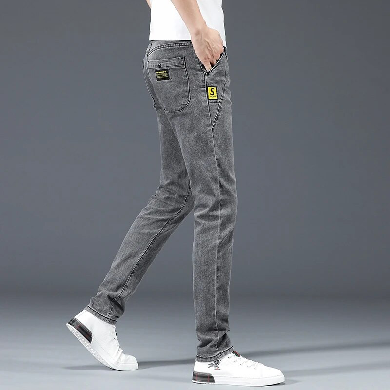 Vīriešu pelēki džinsi Ikdienišķas, elastīgas, plānas, mazas pēdas, garas džinsa bikses Modes, daudzpusīga dizaina ikdienas bikses