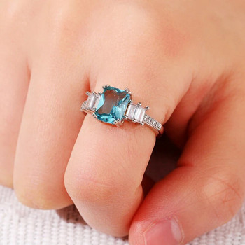 Huitan Елегантни правоъгълни сини CZ Дамски пръстени Изискани подаръци за годишнина от сватба Любовник Аксесоари за темперамент за парти Бижута