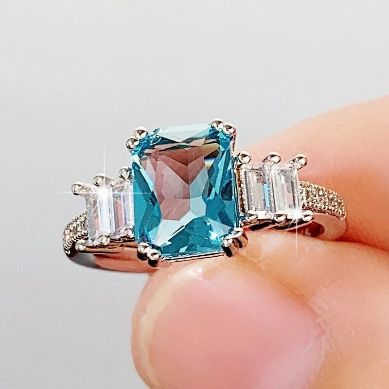 Huitan Eleganti taisnstūrveida zils CZ sieviešu gredzeni Iedomātā kāzu gadadiena mīļāko dāvanu temperamenta aksesuāri ballīšu rotaslietām