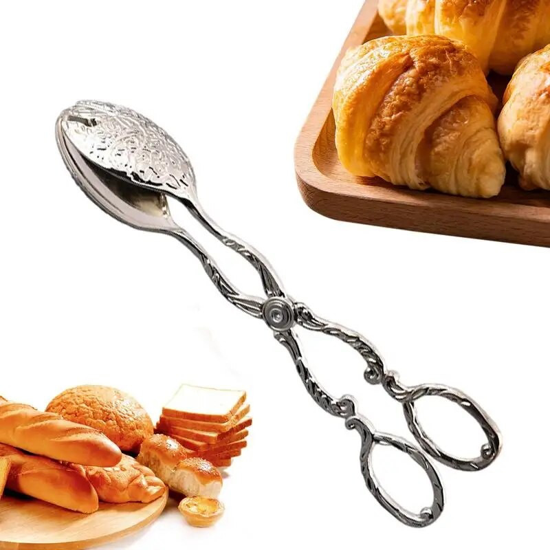 Roostevabast terasest toidutangid Toidulauanõud, mereandide serveerimisvahendid Praetud kala labidas Leivaklamber Köök majapidamises kasutatavad lihaklambrid