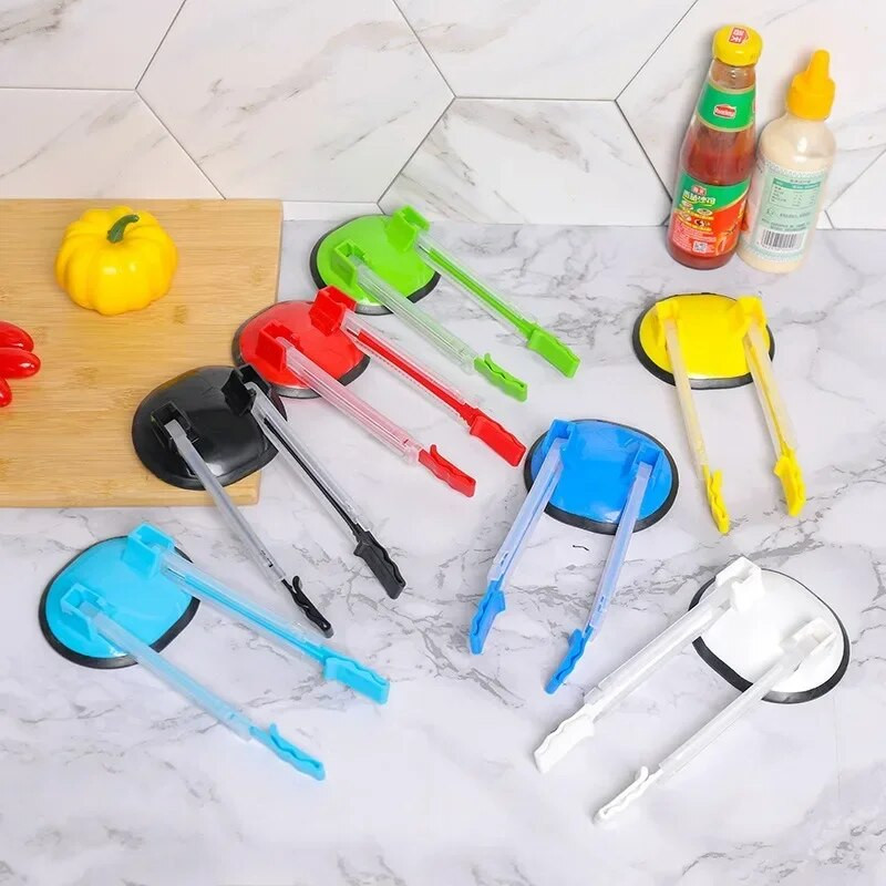 Rāvējslēdzēja slēdzene Uzglabāšanas somas klipsis Regulējams, neslīdošs maisa turētājs Brīvroku plastmasas rokas Maisveida plaukts Sviestmaižu maisiņu plaukti Virtuves sīkrīks