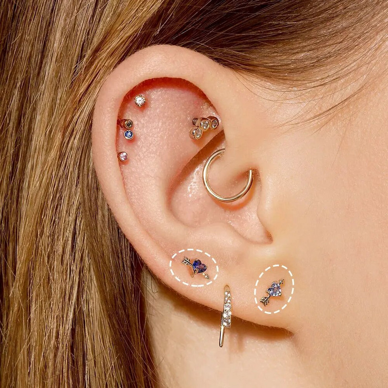 Zila cirkona spirāle Tragus pīrsings ausu auskars sieviešu sirds bultiņa spāre nerūsējošā tērauda skrimšļa starpsienas pīrsings rotaslietas