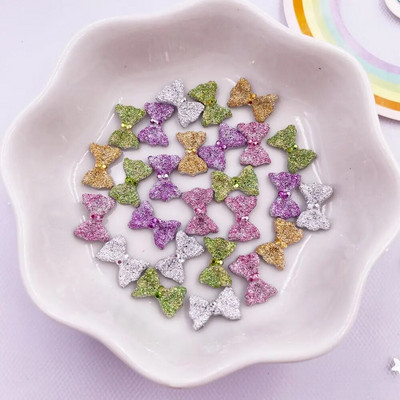 50 gab. 7*10 mm sveķu 3D krāsaini mini banīti, dārgakmeņi plakanā mugurā, figūriņas.