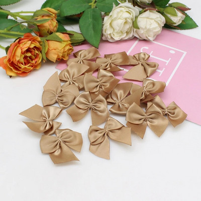 50 gab. Roku darbs Mini satīna lentes bantes Ziemassvētkiem Bowknot Dāvanu bantes amatniecībai Ziedu kāzu bantes dzimšanas dienas DIY ballītes dekorēšana