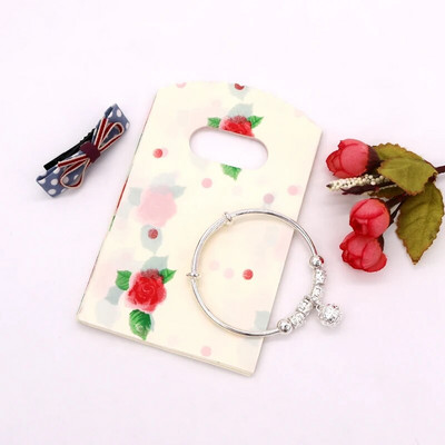 50 vnt. / Lot 9x15cm Maži plastikiniai maišeliai Kelių dizaino dovanų maišelių maišeliai Apyrankės Charms Papuošalų pakavimo maišeliai su rankenomis