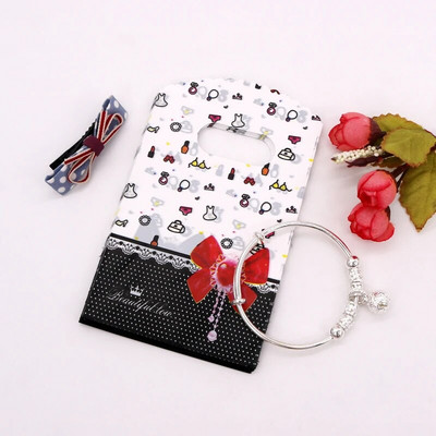 50 vnt. / Lot 9x15cm Maži plastikiniai maišeliai Kelių dizaino dovanų maišelių maišeliai Apyrankės Charms Papuošalų pakavimo maišeliai su rankenomis