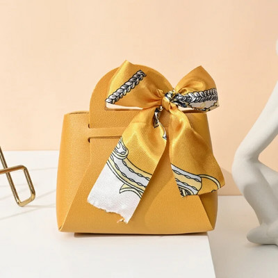 Κορδέλα τσάντα στυλ Κουτί ζαχαρωτών Ευρωπαϊκά δημιουργικά κουτιά ζαχαρωτών γάμου Δερμάτινα φορητά τσάντα καραμέλας Δώρο πίσω Συσκευασία καραμέλας