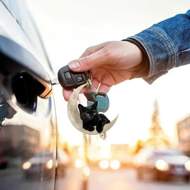 1tk Armas väike must kass, kes lebab kuul Rippuv ornament Multikas armas ripats autokott võtmehoidja ripats auto kaunistused