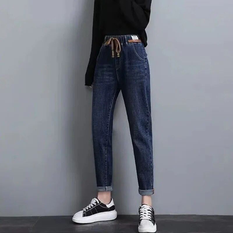 2023. aasta kevadised sügise uued elastsed puuvillased teksad Naiste vabad kõrge vöökohaga Hareni teksapüksid Naiste vabaaja Korea metsikud teksad