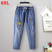 Didelio dydžio tamprūs džinsai moterims laisvomis kišenėmis margintos arlekino spalvos 9 taškų kelnės madingi ir universalūs 6XL 5XL džinsai moteris