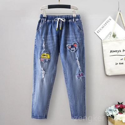 Didelio dydžio tamprūs džinsai moterims laisvomis kišenėmis margintos arlekino spalvos 9 taškų kelnės madingi ir universalūs 6XL 5XL džinsai moteris