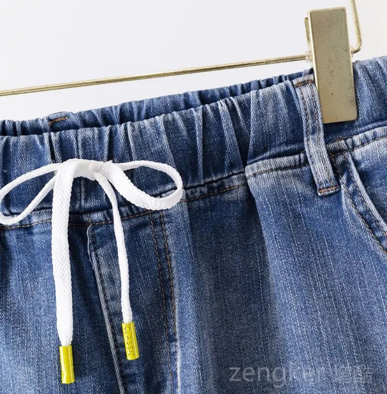 Didelio dydžio tamprūs džinsai moterims laisvomis kišenėmis margintos arlekino spalvos 9 taškų kelnės madingi ir universalūs 6XL 5XL džinsai moteris