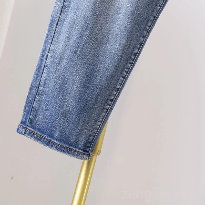 Didelio dydžio tamprūs džinsai moterims laisvomis kišenėmis margintos arlekino spalvos 9 taškų kelnės madingi ir universalūs 6XL 5XL džinsai moteris