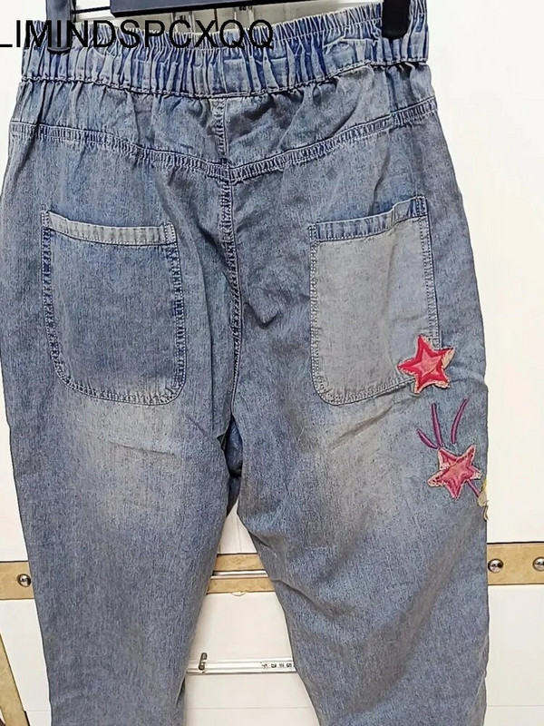 Tampriu juosmeniu, laisvos liekninančios haremo kelnės, moteriškos 2022 m. pavasario ir rudens triušio siuvinėjimas Vandeniu nuplautų skylučių tinkliniai džinsai moteriški