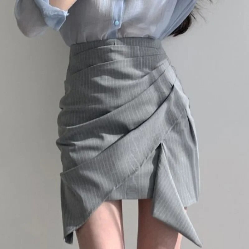 Naiste kõrge vöökohaga miniseelikud Uus kevadine asümmeetriline disain šikk kontoridaam Soliidne temperament Sobivad stiilsed populaarsed Faldad
