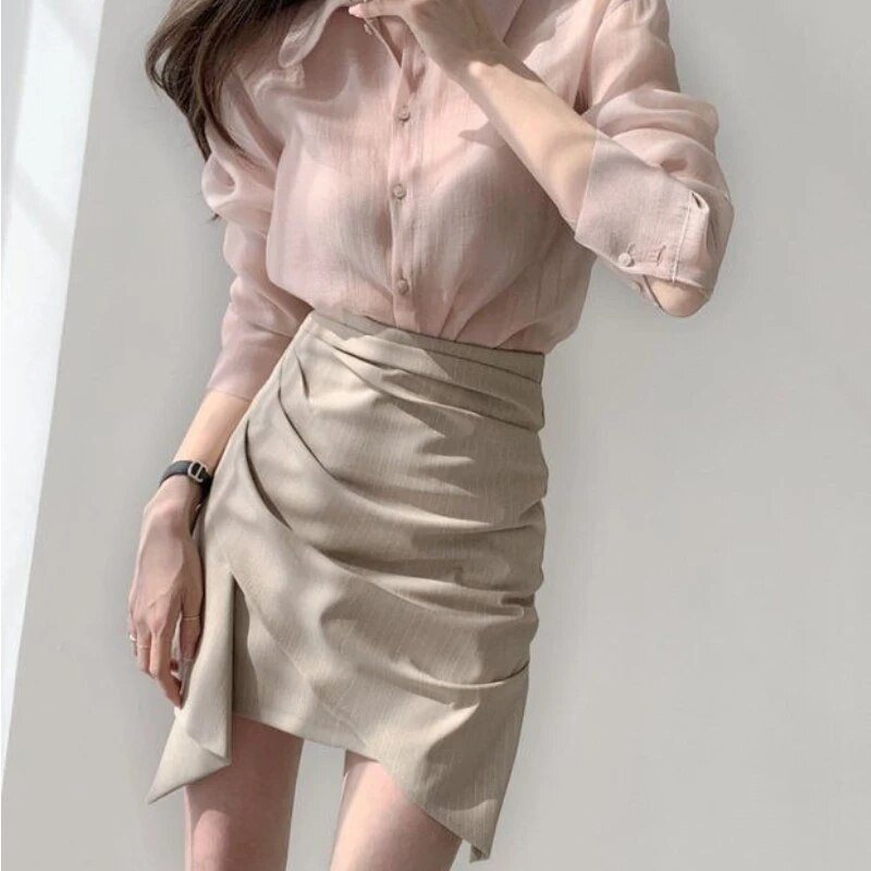 Naiste kõrge vöökohaga miniseelikud Uus kevadine asümmeetriline disain šikk kontoridaam Soliidne temperament Sobivad stiilsed populaarsed Faldad