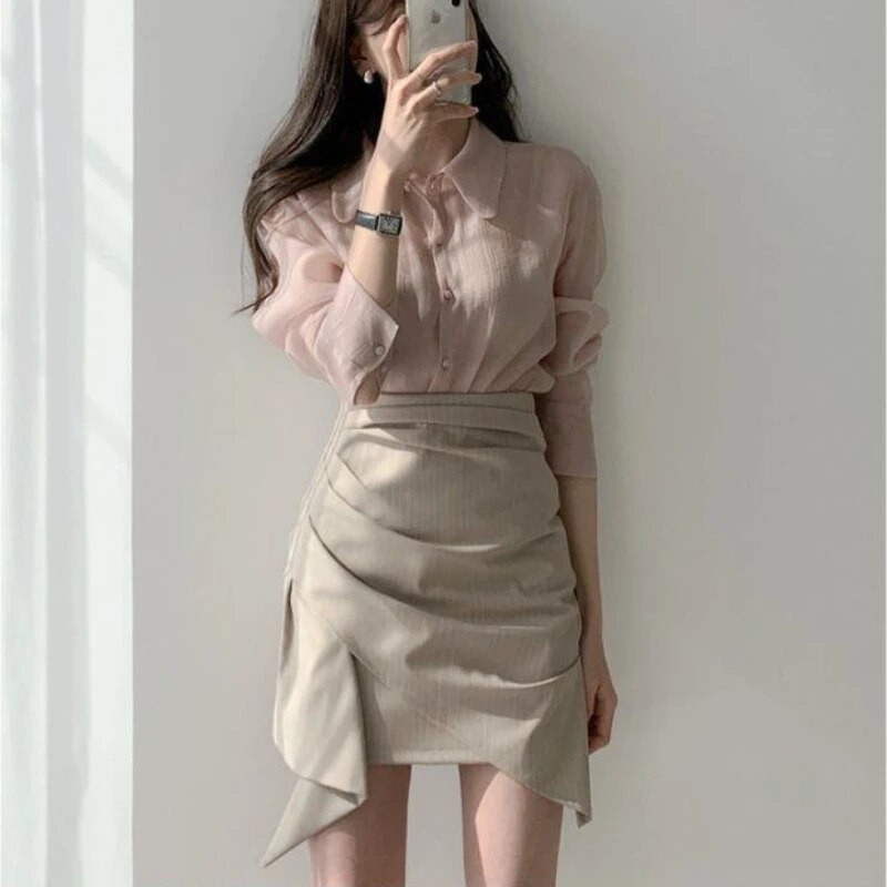 Naiste kõrge vöökohaga miniseelikud Uus kevadine asümmeetriline disain šikk kontoridaam Soliidne temperament Sobivad stiilsed populaarsed Faldad