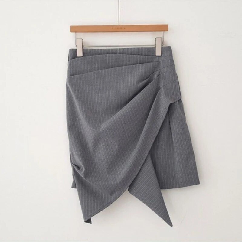 Naiste kõrge vöökohaga miniseelikud Uus kevadine asümmeetriline disain šikk kontoridaam Soliidne temperament Sobivad stiilsed populaarsed Faldad