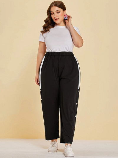 Kevad-suvised uued plusssuuruses tänavastiilis naiste nööpidesainiga tavalised splaissitud riidest vabaajapüksid