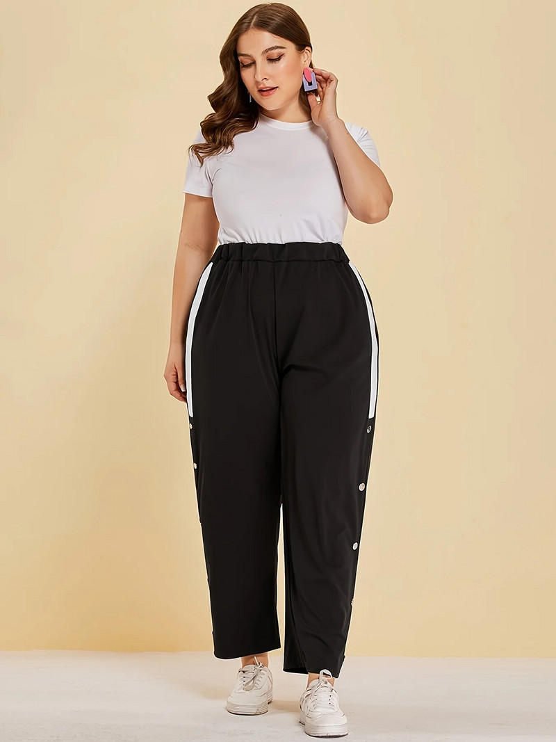 Kevad-suvised uued plusssuuruses tänavastiilis naiste nööpidesainiga tavalised splaissitud riidest vabaajapüksid