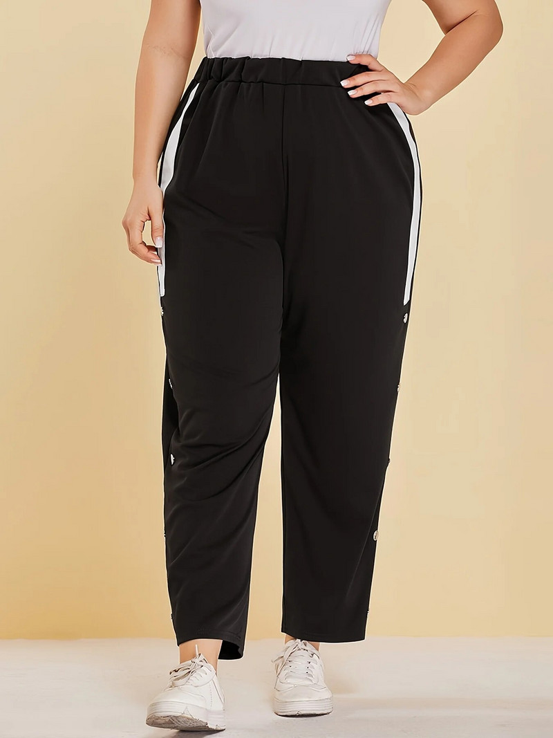 Kevad-suvised uued plusssuuruses tänavastiilis naiste nööpidesainiga tavalised splaissitud riidest vabaajapüksid