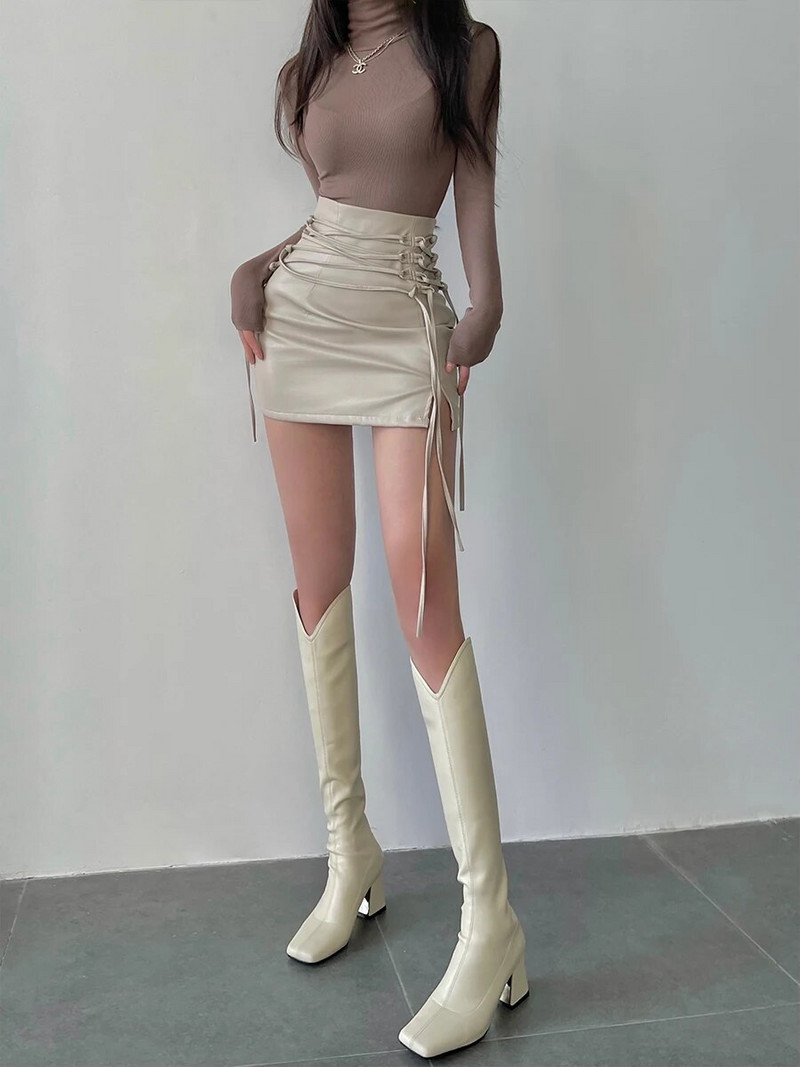 2022. aasta kevad- ja sügismood Pu-nahast seelik, must seksikas kõrge vöökohaga rihmaga pingul kott Puusaseelik, lõhestatud lühikesed seelikud naistele