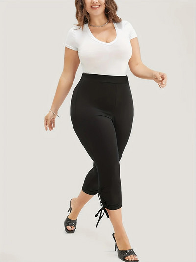 2023. aasta suve uued naiste pluss-suuruses Briti stiilis püksisääre moedisain ühevärvilised, kitsad, kärbitud püksid