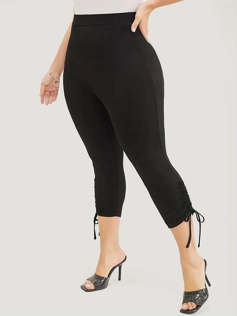 2023. aasta suve uued naiste pluss-suuruses Briti stiilis püksisääre moedisain ühevärvilised, kitsad, kärbitud püksid