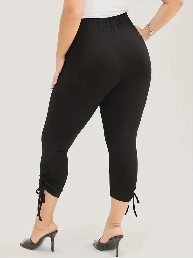 2023. aasta suve uued naiste pluss-suuruses Briti stiilis püksisääre moedisain ühevärvilised, kitsad, kärbitud püksid