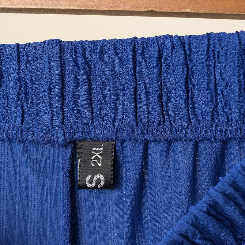 Suures suuruses sirge säärega püksid naiste riided, lahtised kõrge vöökohaga volditud žakaarvärvi alumised püksid 2023. aasta kevadsuvi