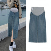 Nėščioms moterims suskirstytas džinsinis pussijonas, vidutinio ilgio moteriškas A formos sijonas, apvyniotas ant klubų