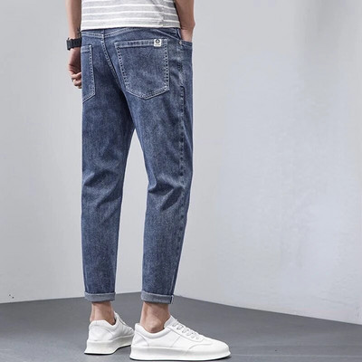 Korea vabaaja püksid Meeste pahkluuni ulatuvad teksad Kvaliteetsed suvised venivad puuvillased augud õhukesed tänavarõivad disain teksapüksid