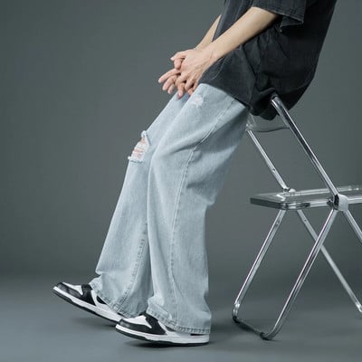 Ανοιξιάτικο και Καλοκαίρι Νέο στυλ είναι λεπτό σκισμένο τζιν Κορεατική μόδα του δρόμου Χαλαρά τζιν παντελόνια φαρδύ μπλε casual παντελόνι