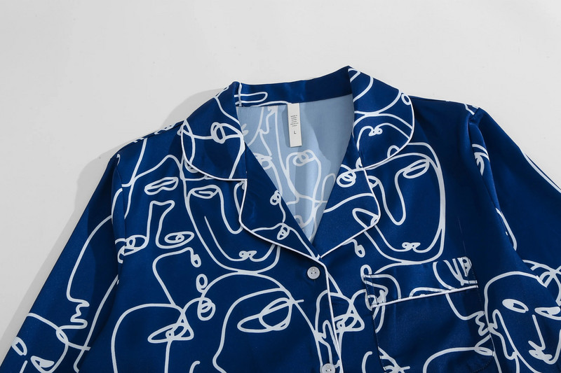 Plava Picasso dvodijelna ženska pidžama s otisnutim apstraktnim linijama s dugim rukavima i hlačama meke teksture prikladna za kućnu odjeću