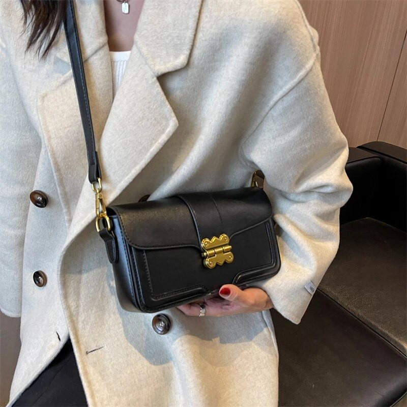 Naiste käekott 2023 uusima trendiga naiste ristkehaga kott Disainer soliidne kett Vintage Elegance Nahast luksusliku disainiga naiste rahakotid