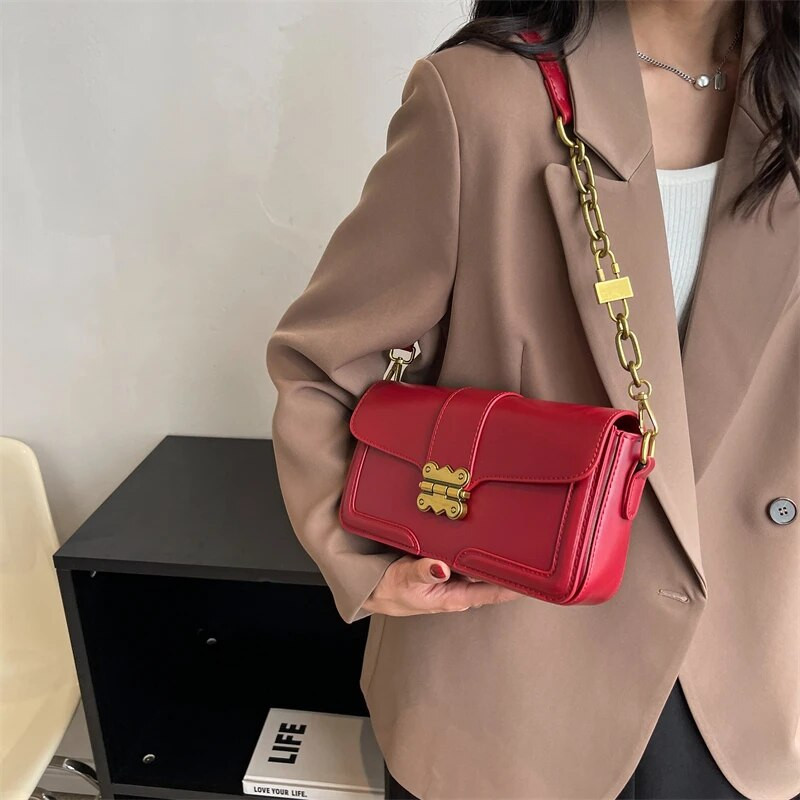 Naiste käekott 2023 uusima trendiga naiste ristkehaga kott Disainer soliidne kett Vintage Elegance Nahast luksusliku disainiga naiste rahakotid