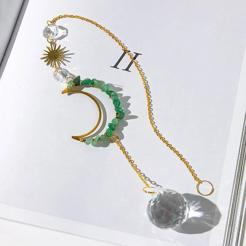 1 tükk töötlemata kivist ja kristallist seinariide, mis on kujundatud kuu ja päikese kujul koduaeda kaunistama