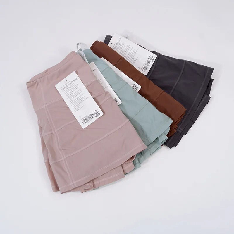 Luluwomen Pace Rival Тенис рокля с висока талия Йога пола Бързосъхнеща плисирана пола Спортна пола за бягане Дамска рокля с джобове